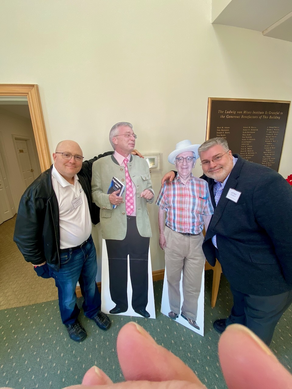 Kinsella, Jeff Barr, with cardboard Hoppe and Rothbard life-size cardboard standees, Mises Institute, Austrian Economics Research Conference 2021, March 20, 2021