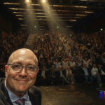 Rothbard Porto - Kinsella speaking and crowd - Beegarc AI Watercolor rendering